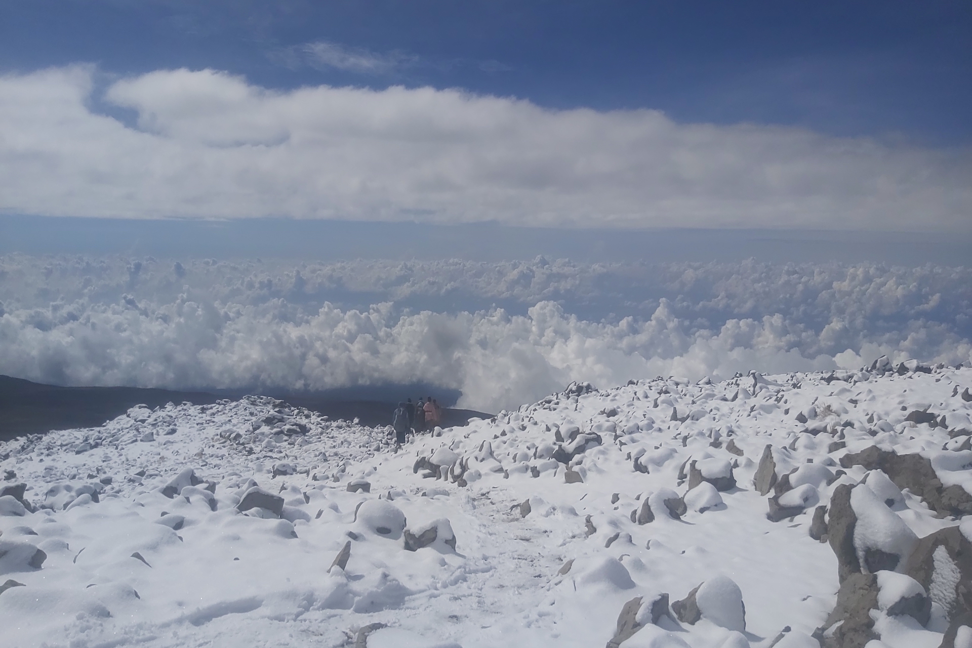 Above Mount Kilimanjaro on bike with AWAT